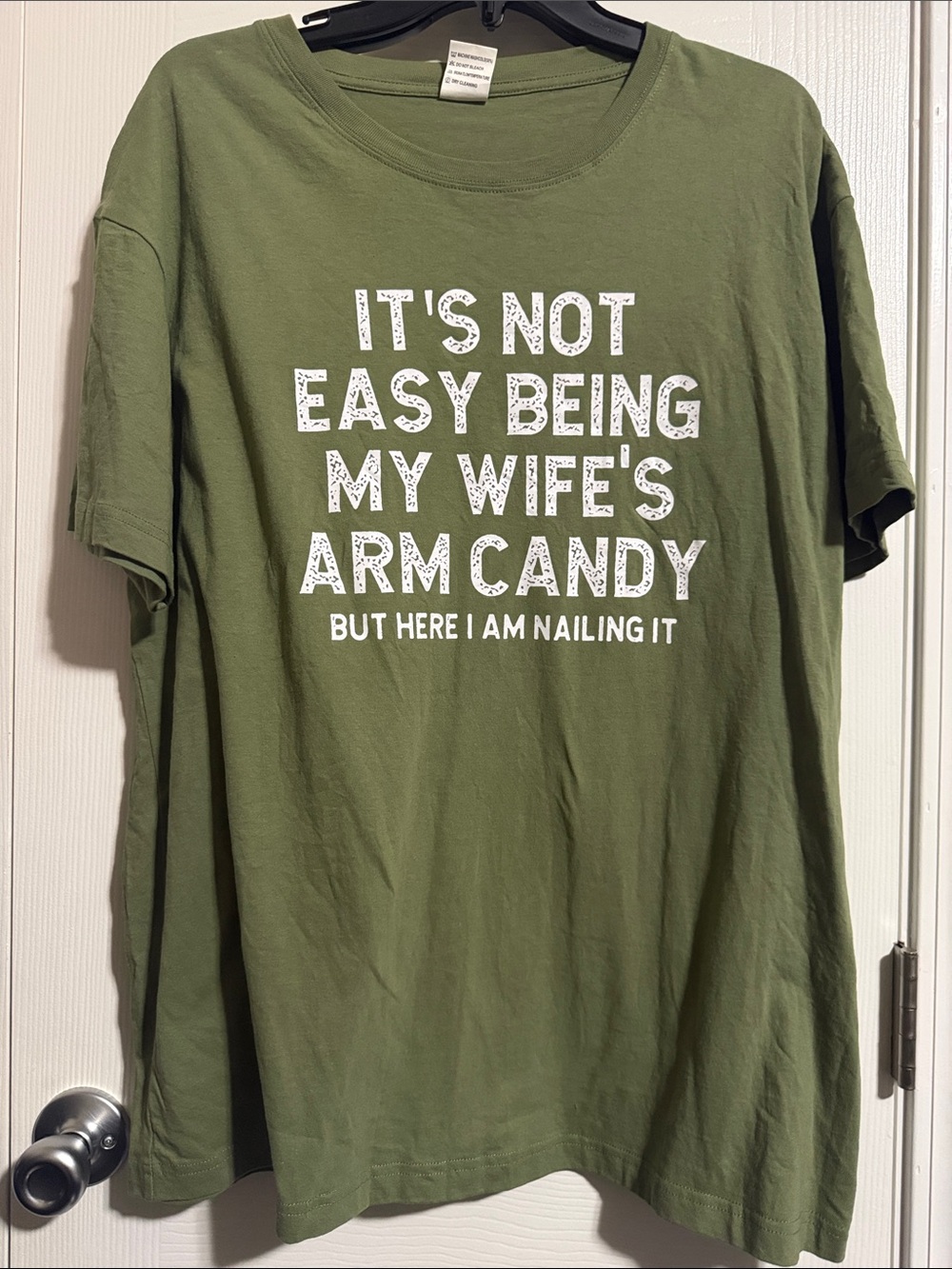 LIKE NEW Graphic Tee - Olive Green "It's Not Easy Being My Wife's Arm Candy"